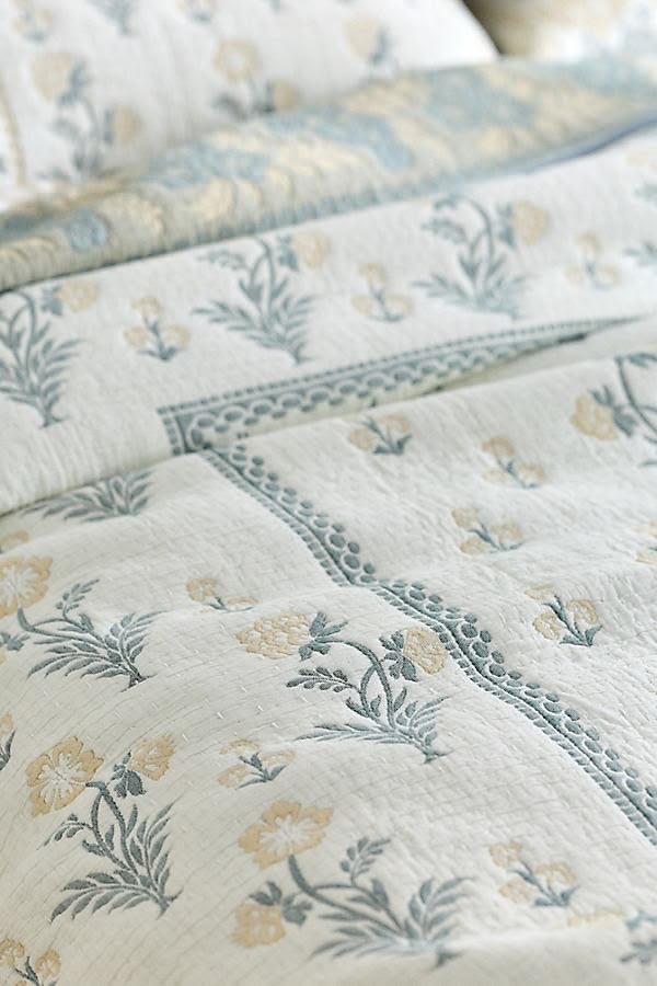 Close view of the Marigold Meadow bedding concept with muted yellow flowers and sage green stems